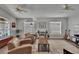 Bright living room with neutral paint, ceiling fans, and large windows at 1406 Bloomingdale Trails Blvd, Brandon, FL 33511