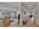Bright living room with neutral paint and access to the other parts of the home at 1406 Bloomingdale Trails Blvd, Brandon, FL 33511