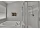Bright, spacious main bathroom with shower and separate soaking tub at 1406 Bloomingdale Trails Blvd, Brandon, FL 33511