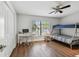 Well-lit bedroom with a bunk bed, laminate flooring, desk, and closet at 14078 Leeward Dr, Seminole, FL 33776