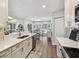 Bright kitchen with stainless steel appliances and a view to the dining area at 14078 Leeward Dr, Seminole, FL 33776