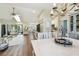 Bright living space with hardwood floors, modern ceiling fan, and dining area at 14078 Leeward Dr, Seminole, FL 33776