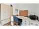 Bright office with white cabinets and desk, perfect for a home office or craft room at 14078 Leeward Dr, Seminole, FL 33776