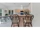 Kitchen with stainless steel appliances, breakfast bar with seating, and a view of the breakfast nook at 15703 Walden Ave, Tampa, FL 33618