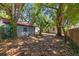 Backyard featuring an exterior building with lush landscaping at 1610 15Th N St, St Petersburg, FL 33704