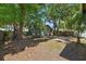 Backyard featuring an exterior building, patio and mature trees at 1610 15Th N St, St Petersburg, FL 33704