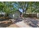 Backyard featuring a patio, exterior building and mature shade trees at 1610 15Th N St, St Petersburg, FL 33704