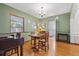 Traditional dining room with hardwood floors, dark wood trim, and access to the adjacent kitchen at 1610 15Th N St, St Petersburg, FL 33704
