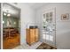 Eat-in kitchen with adjacent dining area, retro tile flooring, and door to outdoor at 1610 15Th N St, St Petersburg, FL 33704