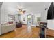 Bright living room featuring hardwood floors, a ceiling fan, and natural light at 1610 15Th N St, St Petersburg, FL 33704
