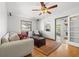 Bright living room featuring hardwood floors, a ceiling fan, and natural light at 1610 15Th N St, St Petersburg, FL 33704