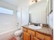 The bathroom has a granite countertop, bathtub, and tile flooring at 16113 Rambling Rd, Odessa, FL 33556