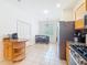 Bright eat-in kitchen featuring tile floors, stainless steel appliances, and granite countertops at 16113 Rambling Rd, Odessa, FL 33556