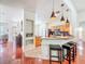 Inviting kitchen has granite counters, stainless appliances, and bar seating, perfect for cooking and entertaining at 16113 Rambling Rd, Odessa, FL 33556