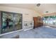 Covered patio entrance to clubhouse with storage lockers, seating, and ample natural light at 1647 Hamilton Ct, Dunedin, FL 34698