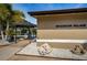 Braemoor Village entrance with blue awning and tropical plants at 1647 Hamilton Ct, Dunedin, FL 34698