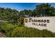 Braemoor Village entrance sign surrounded by lush greenery at 1647 Hamilton Ct, Dunedin, FL 34698