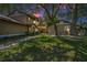 Charming home with lush landscaping, mature trees, and a welcoming entrance for great curb appeal at 1647 Hamilton Ct, Dunedin, FL 34698