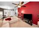 Cozy living area with plush seating, an accent wall, and plenty of natural light at 1647 Hamilton Ct, Dunedin, FL 34698