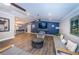 Spacious living room featuring modern decor, an open floor plan, and hardwood floors at 1647 Hamilton Ct, Dunedin, FL 34698