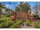 Edgewater Park and Municipal Marina entrance sign with brick pillars and lush landscaping in Dunedin, Florida at 1647 Hamilton Ct, Dunedin, FL 34698