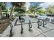 Convenient parking area with bike racks, benches, and nearby street parking, enhancing accessibility to local amenities at 1647 Hamilton Ct, Dunedin, FL 34698