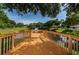 Community pond view from wooden dock shows the water fountain and surrounding landscape at 1647 Hamilton Ct, Dunedin, FL 34698