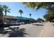 Vibrant street featuring local businesses, palm trees, and convenient street parking, perfect for exploring Dunedin's local scene at 1647 Hamilton Ct, Dunedin, FL 34698