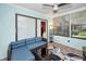 Relaxing sunroom with lots of natural lighting and comfortable wicker furniture at 1647 Hamilton Ct, Dunedin, FL 34698