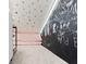 Attic bedroom featuring carpet, blackboard wall and pink daybed at 16633 Goose Ribbon Pl, Wimauma, FL 33598