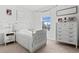 Bright bedroom with natural light, creating a serene and inviting space for relaxation and restful nights at 16633 Goose Ribbon Pl, Wimauma, FL 33598