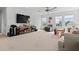 Large bonus room featuring a entertainment center, seating area and natural light from the windows at 16633 Goose Ribbon Pl, Wimauma, FL 33598