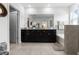 The main bathroom features a double vanity, granite counters, and a separate tub and shower at 16633 Goose Ribbon Pl, Wimauma, FL 33598