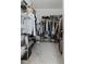 This walk-in closet provides ample storage with shelves and hanging rods for an organized wardrobe at 16633 Goose Ribbon Pl, Wimauma, FL 33598