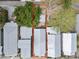 Aerial view shows property lines of a home with mature trees, a patio, and a well-maintained roof at 1708 E 15Th Ave, Tampa, FL 33605