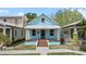 Charming light blue two-story home with a welcoming front porch and colorful accents at 1708 E 15Th Ave, Tampa, FL 33605