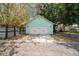 Detached blue garage featuring a white garage door at 1708 E 15Th Ave, Tampa, FL 33605