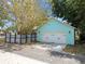 Detached garage with white door and complementary color design, offering ample parking and curb appeal at 1708 E 15Th Ave, Tampa, FL 33605