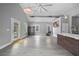 Living area featuring hardwood floors, and a kitchen island with barstool seating at 1708 E 15Th Ave, Tampa, FL 33605
