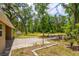 The backyard features a brick patio with a fire pit, perfect for outdoor entertaining at 19266 Campground Rd, Brooksville, FL 34601