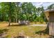 A relaxing backyard, complete with a patio, firepit, and shed, perfect for outdoor enjoyment at 19266 Campground Rd, Brooksville, FL 34601