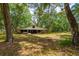 Large outdoor barn surrounded by trees and grass at 19266 Campground Rd, Brooksville, FL 34601