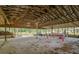 Spacious open barn interior featuring a picnic table and ample room for activities at 19266 Campground Rd, Brooksville, FL 34601