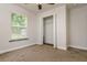 Cozy bedroom with carpet, a closet, and a window that allows in plenty of sunlight at 19266 Campground Rd, Brooksville, FL 34601