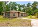 Single-story home with vinyl siding, multiple windows, and well-maintained landscaping at 19266 Campground Rd, Brooksville, FL 34601
