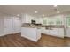 Modern kitchen featuring white cabinets, granite countertops, and stainless steel appliances at 19266 Campground Rd, Brooksville, FL 34601