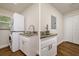 Laundry area with stackable washer/dryer and granite countertops at 19266 Campground Rd, Brooksville, FL 34601