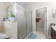 Bathroom featuring glass enclosed shower with decorative accents at 19528 Sunset Bay Dr, Land O Lakes, FL 34638
