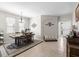 Elegant dining room featuring an area rug, large windows, and decorative wall accents at 19528 Sunset Bay Dr, Land O Lakes, FL 34638