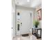 Inviting foyer featuring tile flooring and a white front door with sidelights at 19528 Sunset Bay Dr, Land O Lakes, FL 34638
